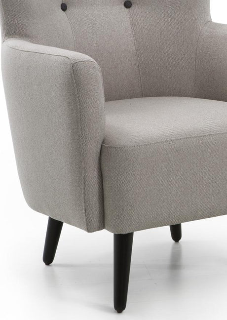 Fauteuil crapaud en tissu beige capiton noir et pieds bois - Souffle d'intérieur